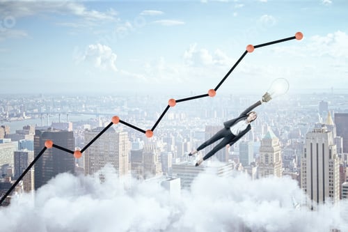 Preview: Businesswoman Flying With Lamp Over The City And Business Charts And Stock Analytics. Success And