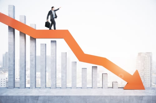 Preview: Attractive Tiny European Man Standing And Balancing On Abstract Red Downward Chart Arrow On Light
