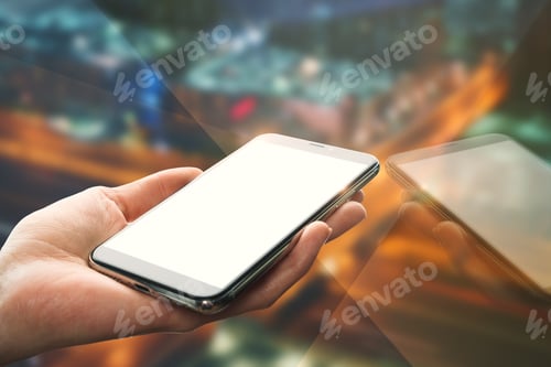 Preview: Hand Holding Empty White Smartphone With Reflection On Blurry Night City Background. Mock Up