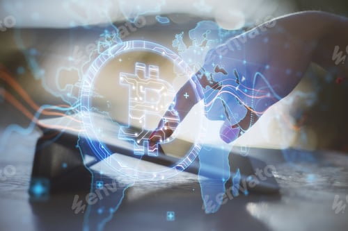 Preview: Close Up Of Hand At Desktop Using Tablet With Creative Glowing Global Bitcoin Hologram On Blurry