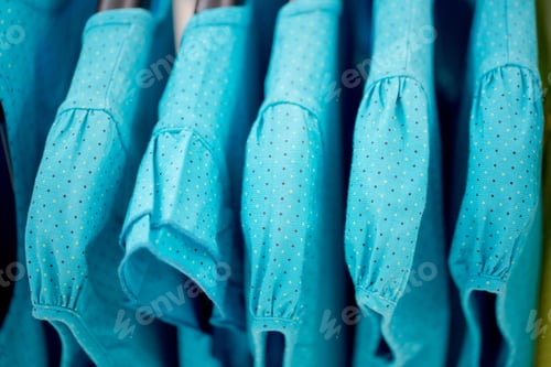Preview: Fashion Clothing On Hangers At The Shop