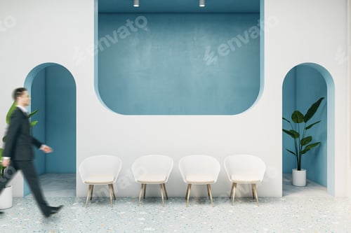 Preview: Businessman Walking In Modern Blue Concrete Waiting Area In Interior With Chairs And Plant