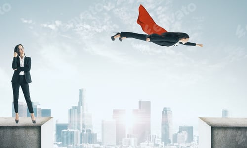 Preview: Businesswoman And Flying Superhero On Rooftop. Teamwork And Leadership Concept