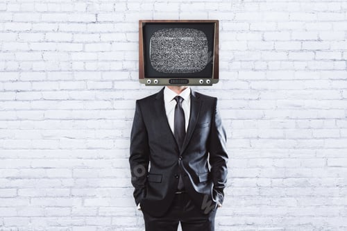 Preview: Tv Headed Businessman Standing On Brick Background With Copy Space