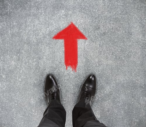 Preview: Top View Of Businessmen Feet On Concrete Floor With Drawn Arrow. Decision Concept