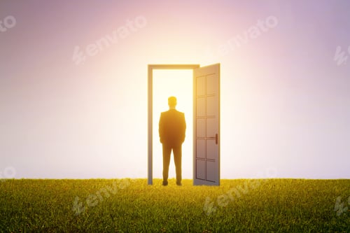 Preview: Successful Businessman Standing In Front Of Bright Door In Abstract Interior With Concrete Wall