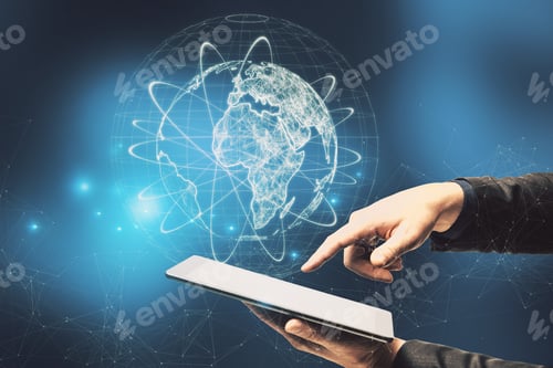 Preview: Close Up Of Businessman Hand Pointing At Tablet With Abstract Glowing Globe Hologram On Blurry Blue