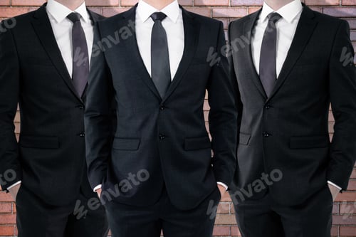Preview: Three Unrecognizable Businessmen On Red Brick Wall Background. Teamwork Concept