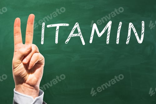 Preview: Hand With Peace Sign Gesture Replacing Letter V In Vitamin Word On Chalkboard Background With Mock