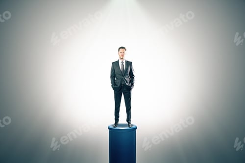 Preview: Young Businessman Standing On Illuminated Pedestal. Success And Leadership Concept