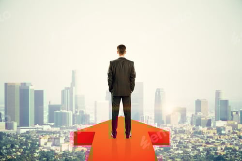Preview: Back View Of Young Businessman Standing On Red Arrow On New York City Background. Growth And