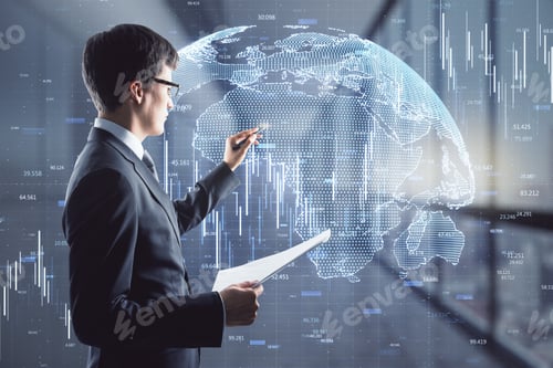 Preview: Attractive Young European Businessman With Document Standing In Blurry Office Interior With