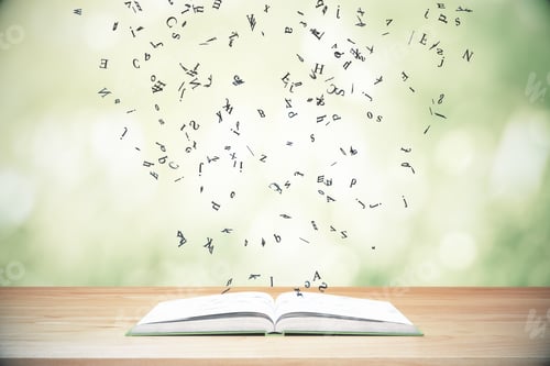 Preview: Flying Letters From The Opened Book On Wooden Table