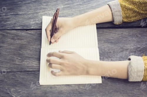 Preview: Girl With Pen And Blank Diary On Wooden Table