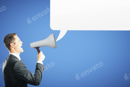 Preview: Side View Of Young Businessman Screaming Into Megaphone On Blue Background With Empty Speech