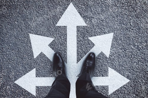 Preview: Top View Of Businessman Feet With Arrows On Concrete Background. Different Direction And Leadership