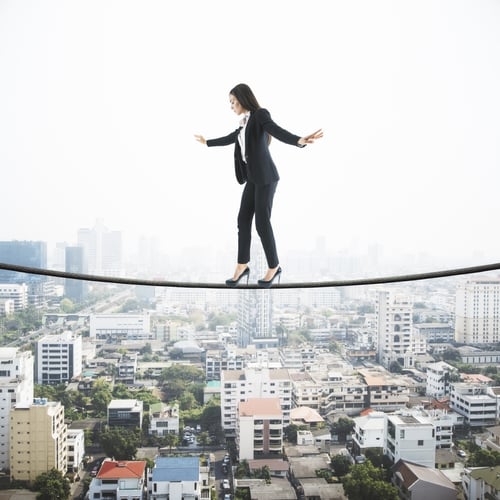 Preview: Businesswoman Balancing On A String Over The City, City View With Scyscrapers In The Background