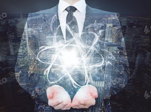 Preview: Businessman Holding Abstract Atom On Night City Background. Double Exposure. Science Concept