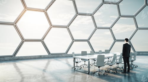 Preview: Businessman And Modern White Conference Table In Spacious Hall With Futuristic Interior.