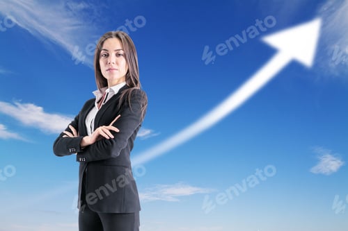 Preview: Confident Businesswoman Standing With An Arrow Up In The Background With Clear Sky, Success And