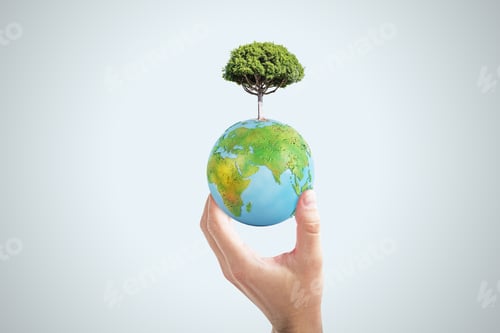 Preview: Close Up Of Female Hand Holding Abstract Globe With Tree On Light Background. World, Earth, Ecology