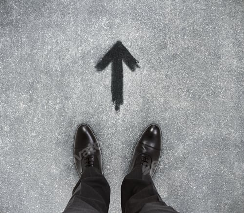 Preview: Top View Of Businessmen Feet On Concrete Floor With Drawn Arrow. Motivation Concept