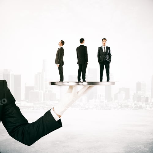 Preview: Hand Holding Silver Tray With Three Tiny Businessmen On Blue Background. Hr Concept