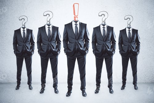 Preview: Row Of Question And Exclamation Mark Headed Businessmen Standing In Abstract Concrete Interior