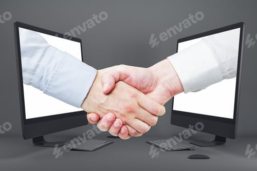 Preview: Businessmen Shaking Hands Through Computer Screens On Gray Background. Teamwork And Digital