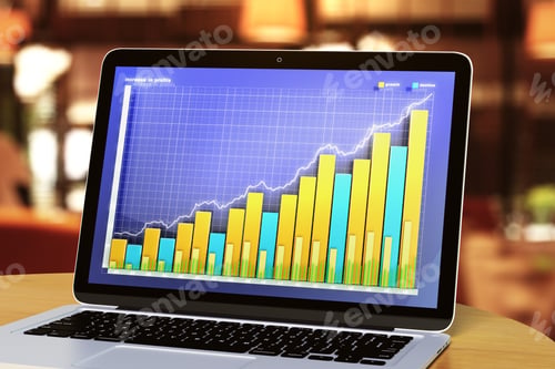 Preview: Laptop With Business Graph On A Wooden Table