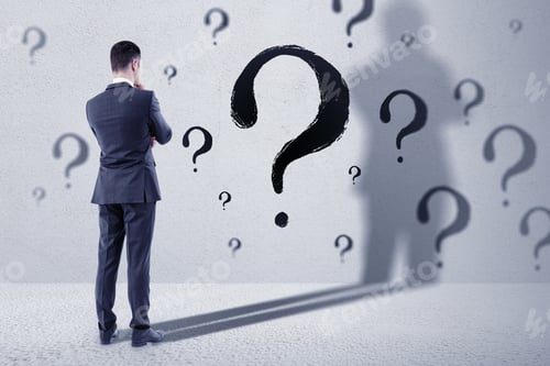 Preview: Pensive Young European Businessman Standing In Concete Interior With Question Mark Sketch. Solution