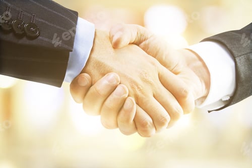 Preview: Handshake On A Blured Yellow Background