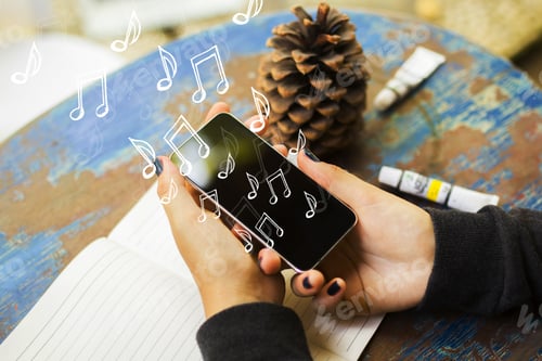 Preview: Hand Holding Phone With Notes. Music, Hobby And App Concept