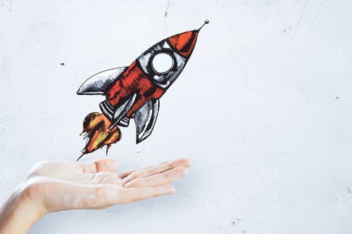 Preview: Hand Holding Creative Rocket Sketch On Concrete Wall Background. Startup And Project Concept