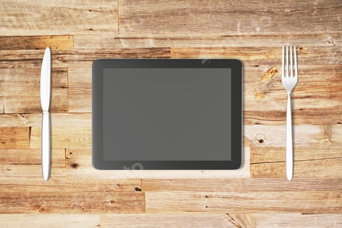 Preview: Digital Tablet With Fork And Knife On A Wooden Table