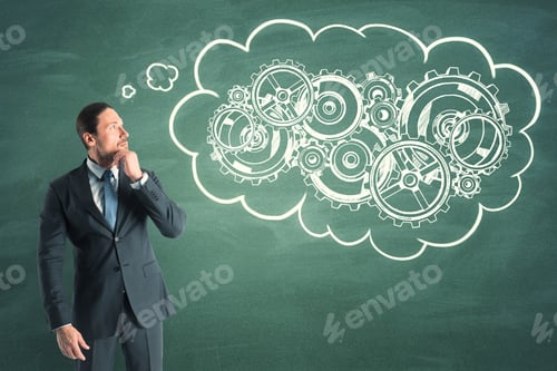 Preview: Portrait Of Attractive Young Businessman Thinking Of Cogwheels Sketch On Chalkboard Background