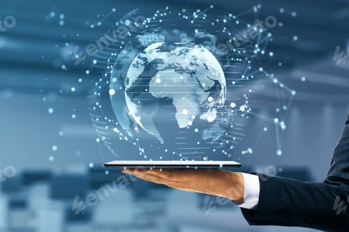 Preview: Businessman Hand Holding Tablet With Glowing Globe Interface On Blurry Office Background. Global
