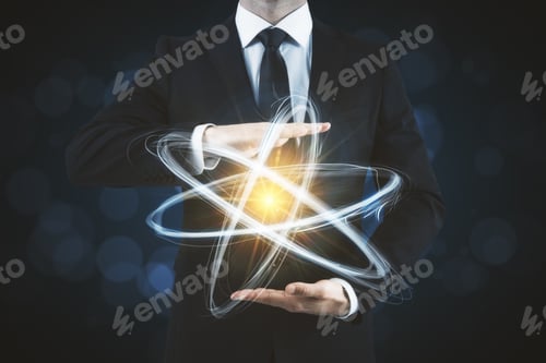 Preview: Businessman Holding Creative Atom On Blurry Dark Background. Medicine And Science Concept
