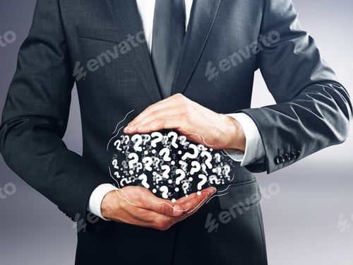Preview: Businessman Holding Pile Of Drawn Question Marks On Grey Background. Faq Concept