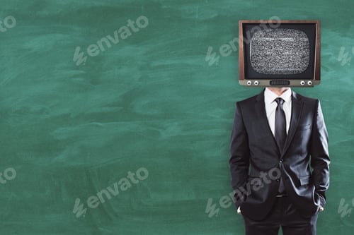 Preview: Tv Headed Businessman Standing On Chalkboard Background With Copy Space