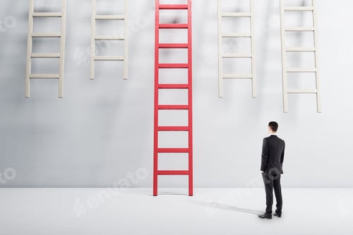 Preview: Businessman Standing In White Interior And Looking On Red Ladder. Success And Startup Concept.