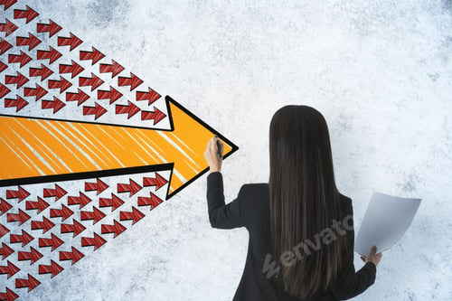 Preview: Businesswoman With Paper In Hand Drawing Group Arrows On Concrete Wall. Leadership And Challenge