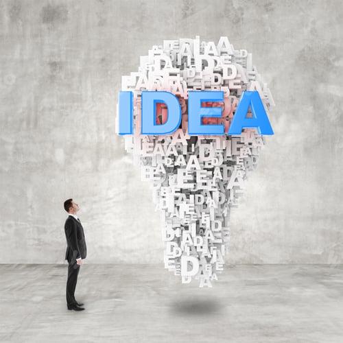 Preview: Businessman In Suit Looking To Idea Sign