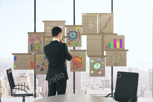 Preview: Businessman With Business Scheme Concept Posters On The Window In Conference Room
