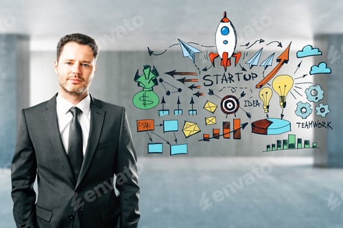 Preview: Attractive Young European Businessman With Start Up Sketch Standing In Blurry Office Interior