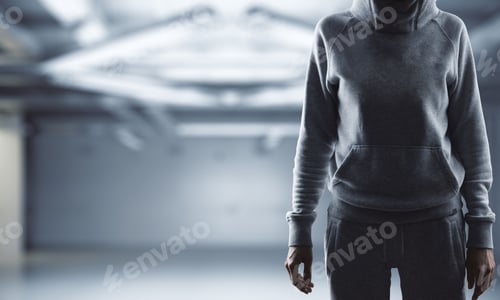 Preview: Unrecoignizable Woman With Hood Standing In Blurry Interior With Copy Space. Hacker And Data