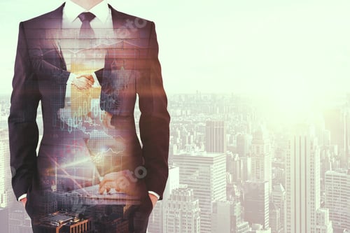 Preview: Businessman On Toned City Background With Handshake And Forex Chart. Teamwork Concept. Double