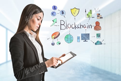 Preview: Attractive Young Businesswoman Using Tablet In Modern Blurry Office Interior With Blockchain