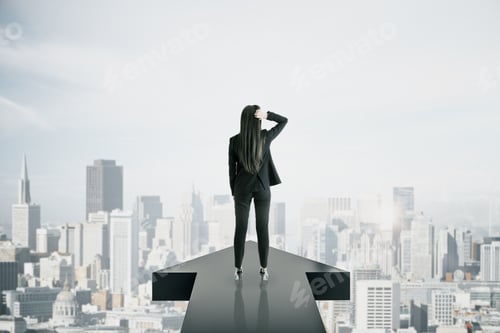 Preview: Back View Of Young Businesswoman Standing On Arrow On New York City Background. Growth And