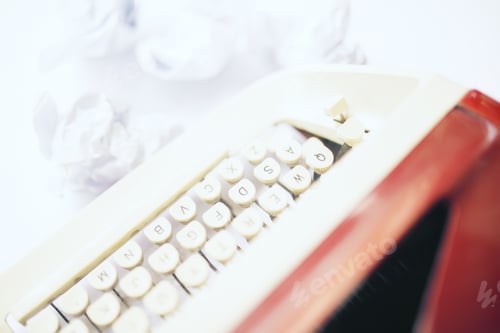 Preview: Closeup Of A Red Typing Machine On White Table. Sideview